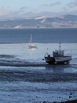 SX11908 Beached sailboat and catamaran.jpg